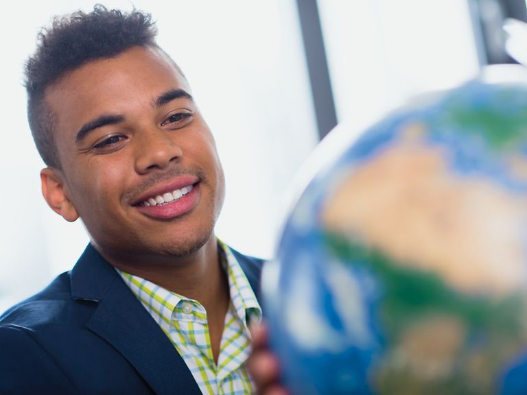 working-areas-image-purchasing Young man looks at globe